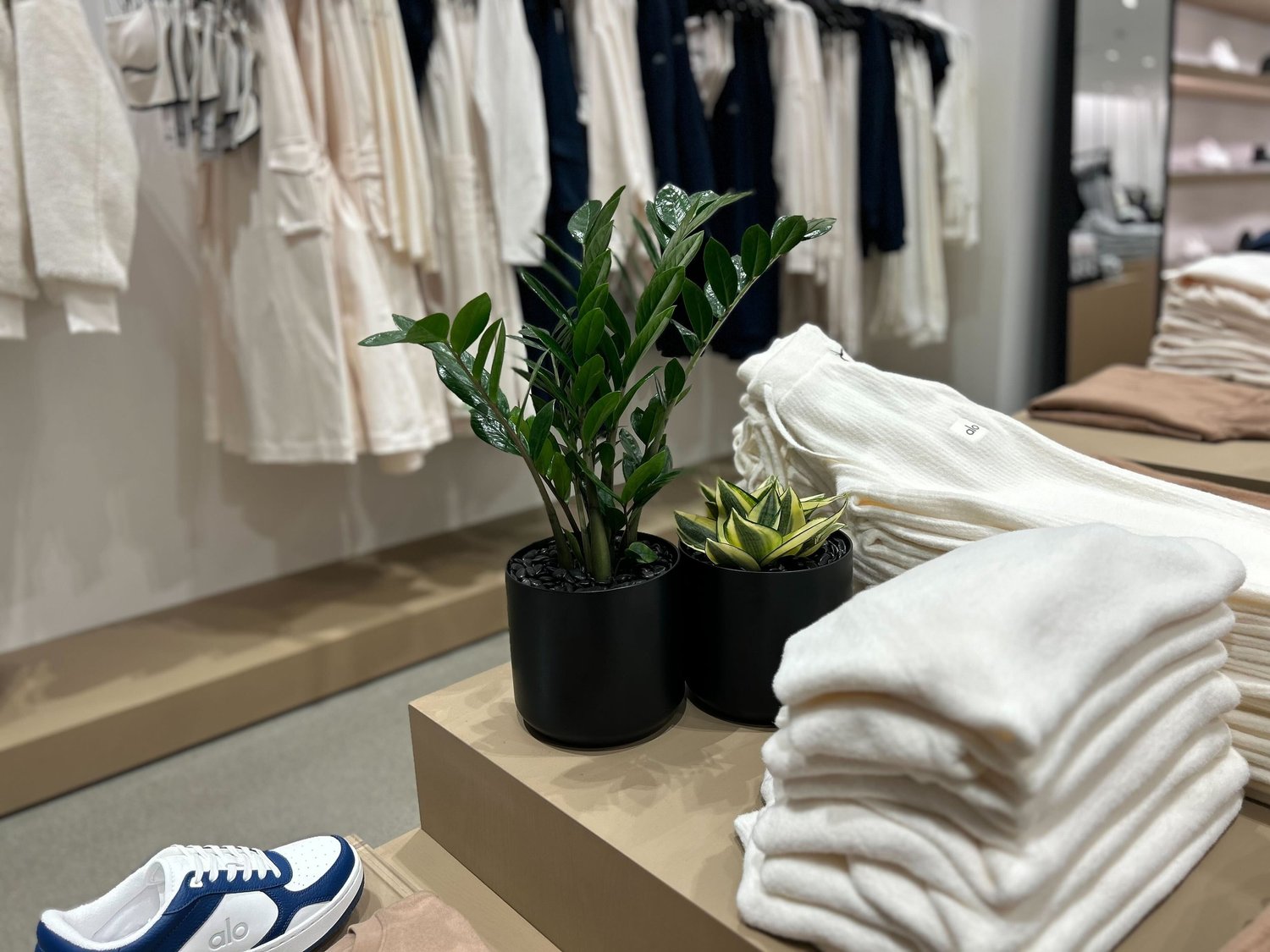 Retail clothing store with plants enhancing the shopping environment
